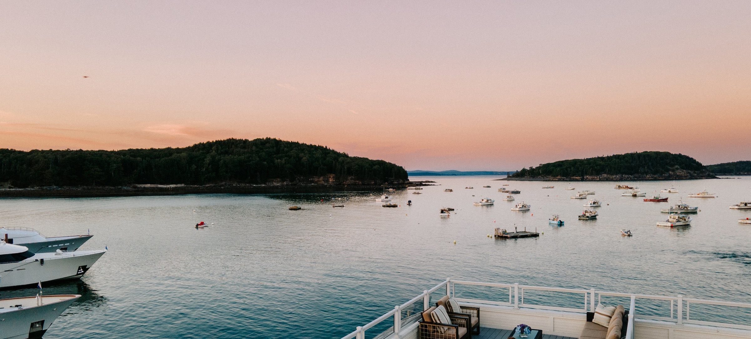 Harborside sunset view of islands and boats