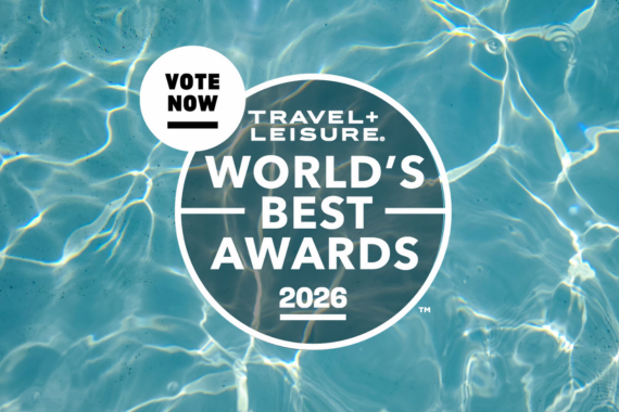Circular Travel + Leisure Worlds Best Awards 2026 logo over clear blue water. A white circle in the top left says Vote Now. Sunlight reflects off the water, creating bright patterns.